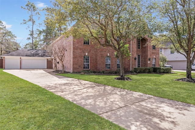 12014 Via Davinci Ln NW, Cypress, TX 77429 - view of front facade with a front lawn and brick siding