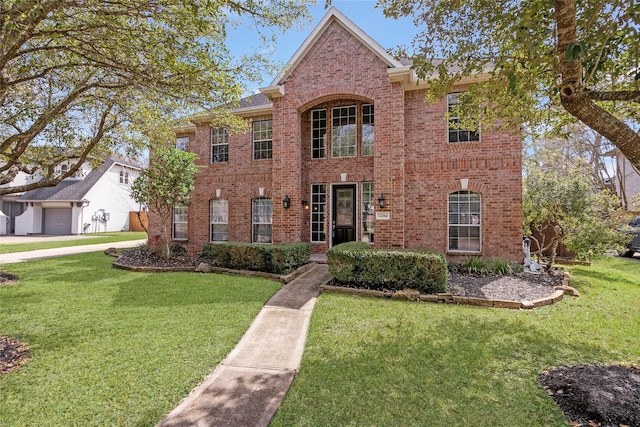 12014 Via Davinci Ln NW, Cypress, TX 77429 - view of front of property featuring brick siding and a front lawn