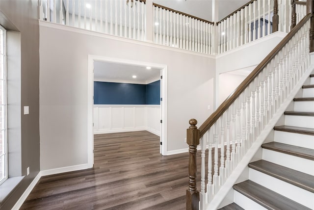 12014 Via Davinci Ln NW, Cypress, TX 77429 - stairs featuring a towering ceiling, wood finished floors, and wainscoting
