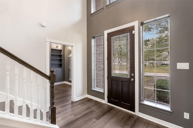 12014 Via Davinci Ln NW, Cypress, TX 77429 - entrance foyer featuring plenty of natural light, dark wood finished floors, and stairs