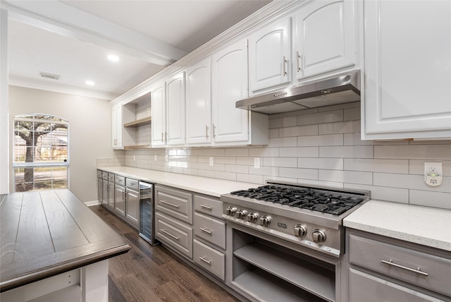 12014 Via Davinci Ln NW, Cypress, TX 77429 - kitchen with open shelves, stainless steel gas cooktop, wine cooler, under cabinet range hood, and gray cabinetry