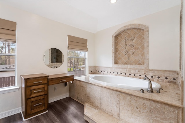 12014 Via Davinci Ln NW, Cypress, TX 77429 - full bathroom featuring a bath, wood finished floors, and vanity
