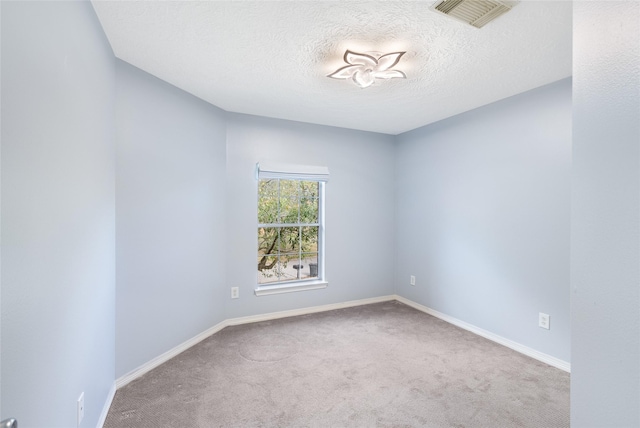 12014 Via Davinci Ln NW, Cypress, TX 77429 - empty room featuring carpet floors and a textured ceiling
