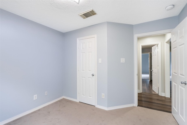 12014 Via Davinci Ln NW, Cypress, TX 77429 - unfurnished bedroom featuring carpet floors and baseboards