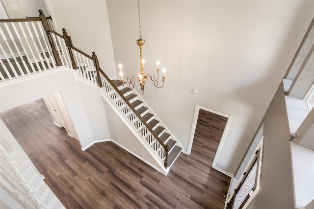 12014 Via Davinci Ln NW, Cypress, TX 77429 - stairway with a towering ceiling, wood finished floors, and a chandelier