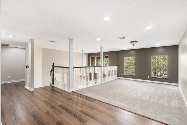 12014 Via Davinci Ln NW, Cypress, TX 77429 - empty room with wood finished floors and recessed lighting