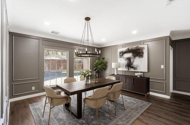 12014 Via Davinci Ln NW, Cypress, TX 77429 - dining space with a decorative wall, a chandelier, dark wood-type flooring, ornamental molding, and recessed lighting