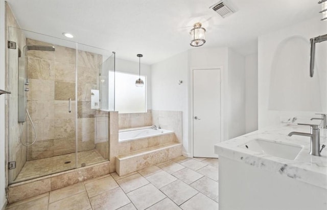 3818 Childress St, Houston, TX 77005 - bathroom featuring a garden tub, a stall shower, double vanity, tile patterned flooring, and recessed lighting