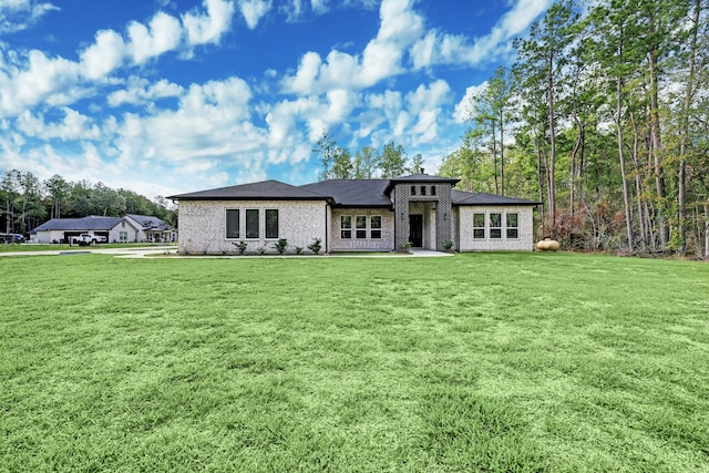 13 Rd 66111, Dayton, TX 77535 - prairie-style house with a front yard and brick siding