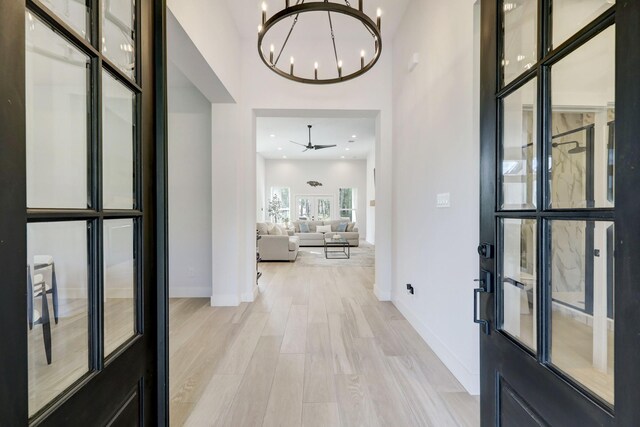 13 Rd 66111, Dayton, TX 77535 - entryway featuring a chandelier and light wood-style floors