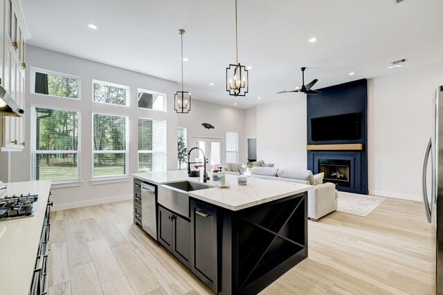 13 Rd 66111, Dayton, TX 77535 - kitchen with ceiling fan, a large fireplace, healthy amount of natural light, and recessed lighting