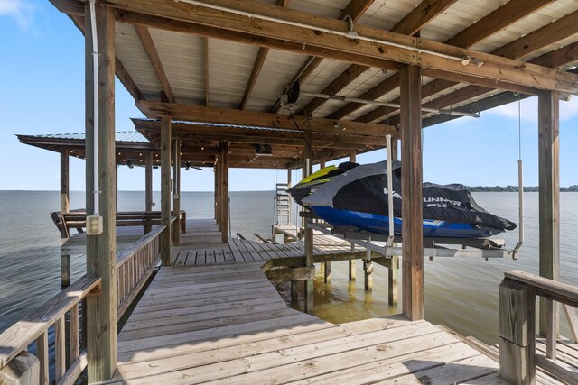 426 Apollo Dr, Livingston, TX 77351 - dock area featuring boat lift and a water view