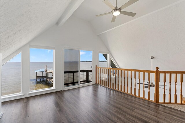 426 Apollo Dr, Livingston, TX 77351 - additional living space with a water view, ceiling fan, beamed ceiling, wood finished floors, and high vaulted ceiling