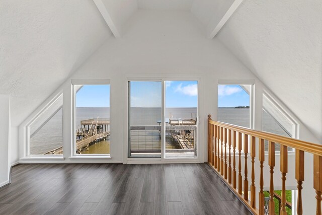 426 Apollo Dr, Livingston, TX 77351 - bonus room featuring a water view, lofted ceiling, and wood finished floors