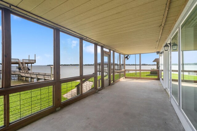 426 Apollo Dr, Livingston, TX 77351 - unfurnished sunroom with a water view