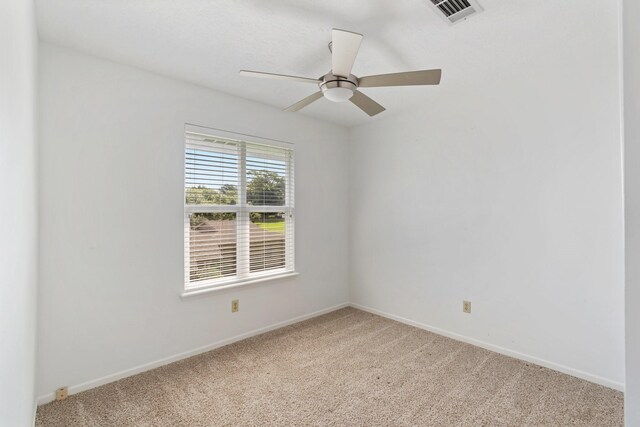 426 Apollo Dr, Livingston, TX 77351 - spare room with light carpet and ceiling fan