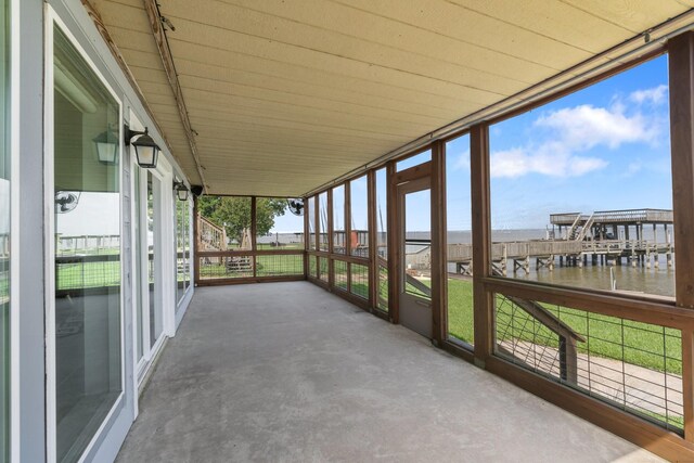 426 Apollo Dr, Livingston, TX 77351 - unfurnished sunroom featuring a water view