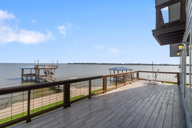 426 Apollo Dr, Livingston, TX 77351 - wooden terrace with a water view