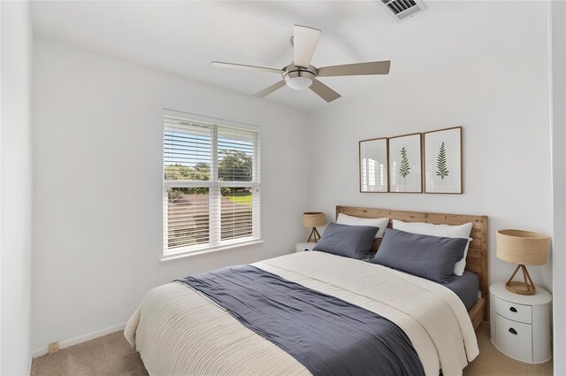 426 Apollo Dr, Livingston, TX 77351 - bedroom featuring light carpet and a ceiling fan