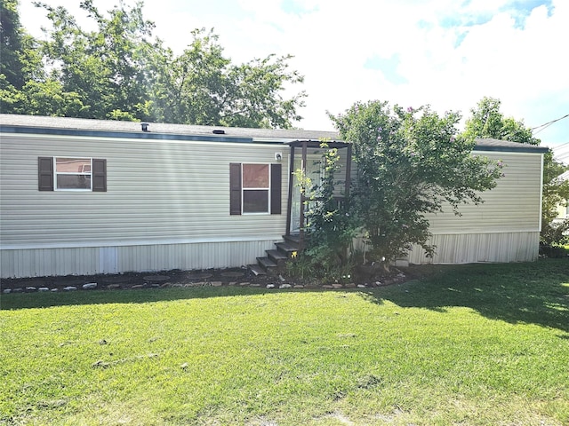 11670 Vistawood St, Willis, TX 77318 - view of property exterior featuring a yard