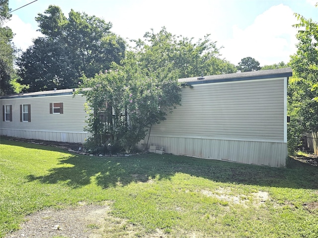 11670 Vistawood St, Willis, TX 77318 - view of side of home with a lawn