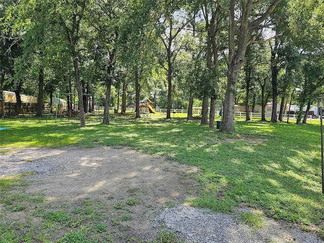 11670 Vistawood St, Willis, TX 77318 - view of yard featuring a playground