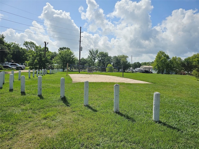 11670 Vistawood St, Willis, TX 77318 - view of community featuring volleyball court and a lawn
