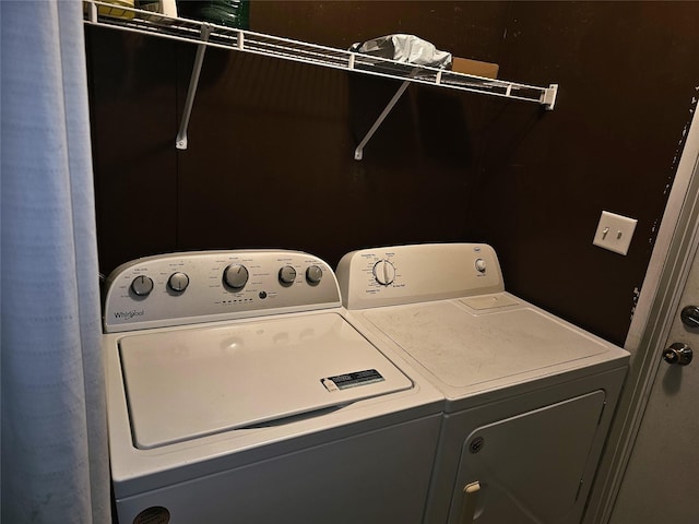 11670 Vistawood St, Willis, TX 77318 - laundry area with washing machine and clothes dryer
