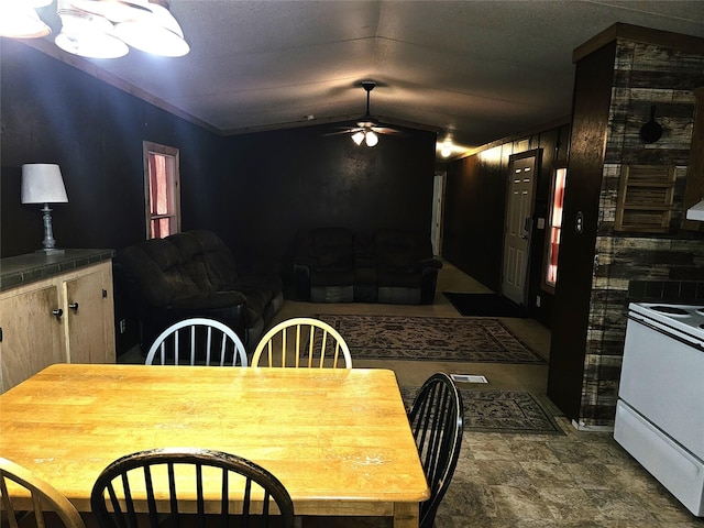 11670 Vistawood St, Willis, TX 77318 - dining area with a ceiling fan and stone finish floors