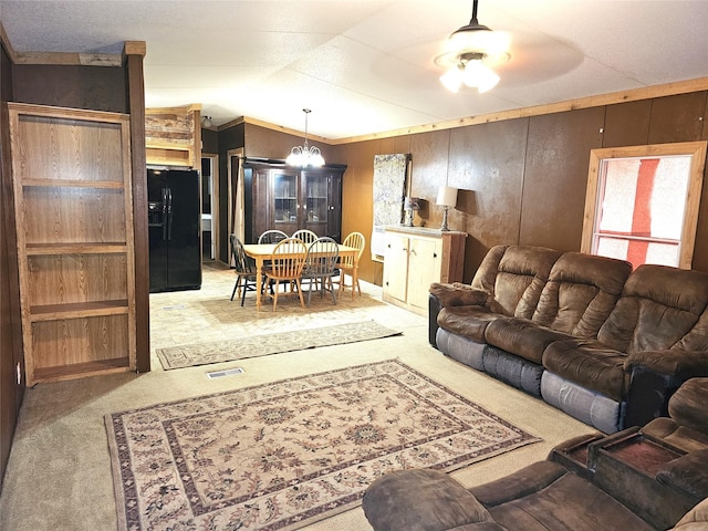 11670 Vistawood St, Willis, TX 77318 - living area with carpet floors, lofted ceiling, a ceiling fan, and wooden walls