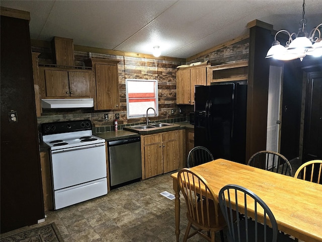 11670 Vistawood St, Willis, TX 77318 - kitchen featuring stainless steel dishwasher, electric stove, black fridge, dark countertops, and under cabinet range hood