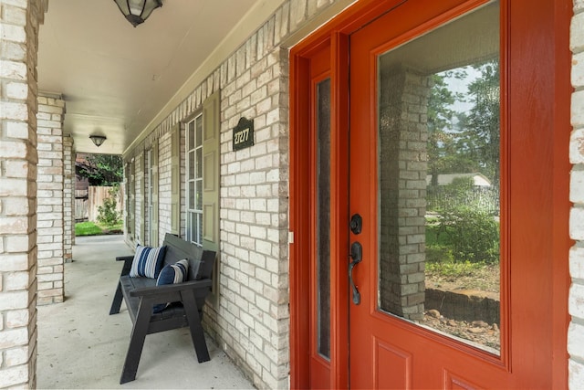 27277 Wells Ln, Conroe, TX 77385 - property entrance featuring covered porch and brick siding
