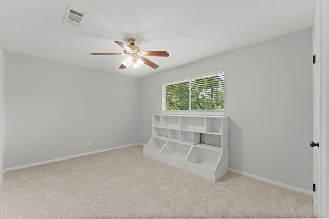 27277 Wells Ln, Conroe, TX 77385 - unfurnished bedroom featuring carpet floors and ceiling fan