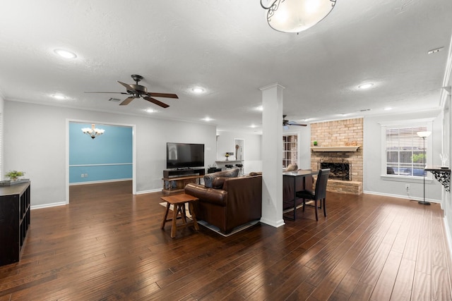 27277 Wells Ln, Conroe, TX 77385 - living area with ceiling fan, a brick fireplace, recessed lighting, wood-type flooring, and a chandelier