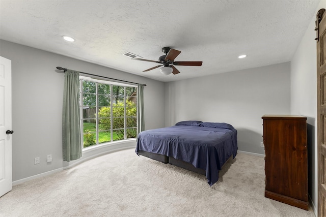 27277 Wells Ln, Conroe, TX 77385 - bedroom with light carpet, recessed lighting, a textured ceiling, and a ceiling fan