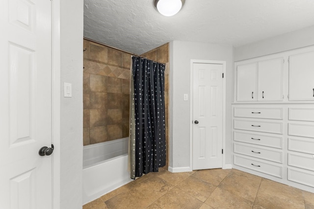 27277 Wells Ln, Conroe, TX 77385 - bathroom with shower / bath combo, a textured ceiling, and tile patterned floors
