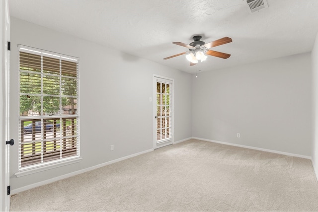 27277 Wells Ln, Conroe, TX 77385 - carpeted spare room with a ceiling fan and baseboards