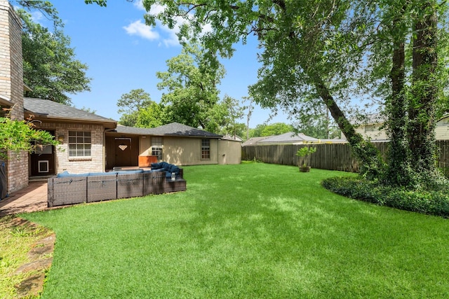 27277 Wells Ln, Conroe, TX 77385 - fenced backyard featuring an outdoor living space