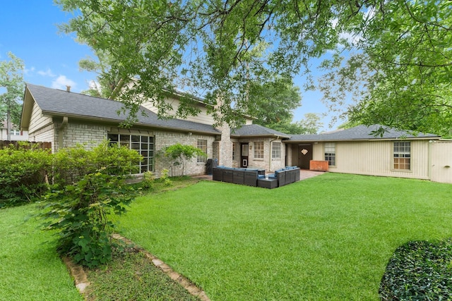 27277 Wells Ln, Conroe, TX 77385 - rear view of property with outdoor lounge area, a yard, a shingled roof, and a chimney