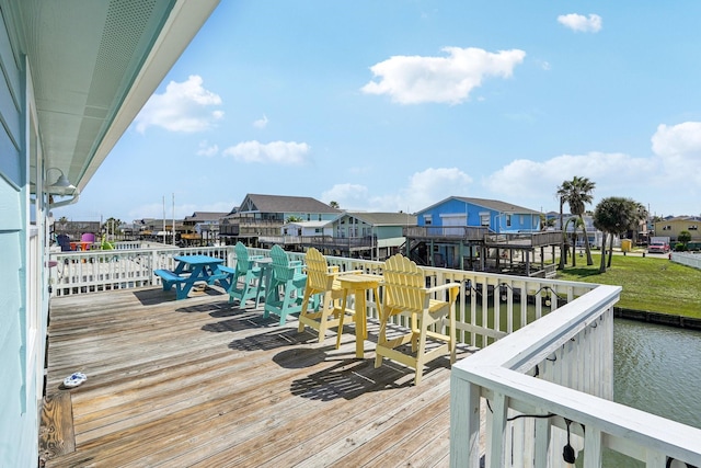 22123 Yoakum Dr, Galveston, TX 77554 - wooden terrace with a water view and a residential view