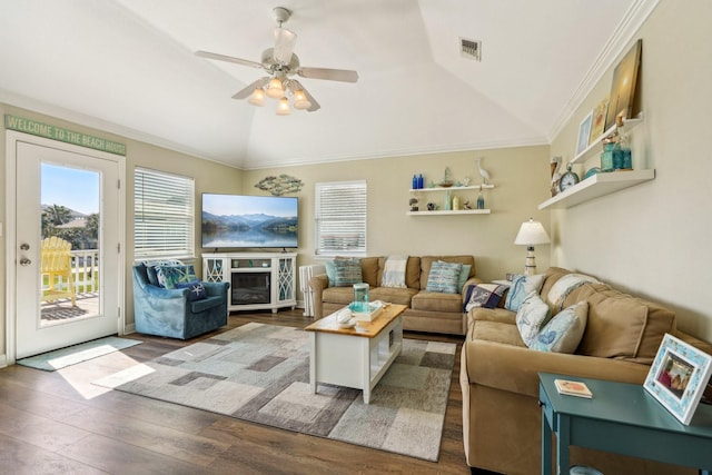 22123 Yoakum Dr, Galveston, TX 77554 - living room featuring wood finished floors, lofted ceiling, ceiling fan, and crown molding