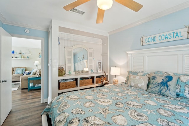 22123 Yoakum Dr, Galveston, TX 77554 - bedroom with ornamental molding, wood finished floors, and ceiling fan