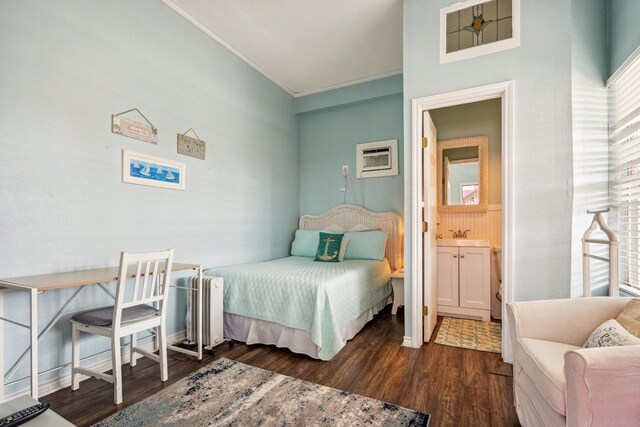 22123 Yoakum Dr, Galveston, TX 77554 - bedroom with ornamental molding, wood finished floors, and a wall mounted air conditioner