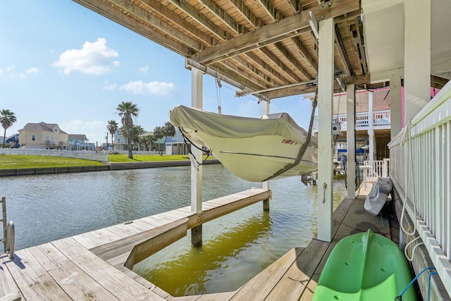 22123 Yoakum Dr, Galveston, TX 77554 - dock featuring a water view, boat lift, and a residential view
