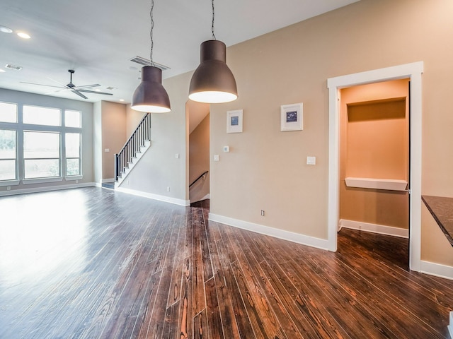 3419 Gillespie St, Houston, TX 77020 - unfurnished living room with a ceiling fan, dark wood-style flooring, stairs, and recessed lighting