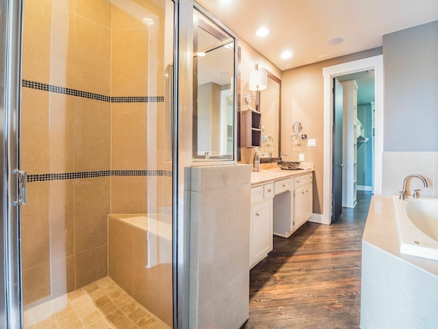 3419 Gillespie St, Houston, TX 77020 - full bath featuring vanity, a shower stall, a bath, and wood finished floors