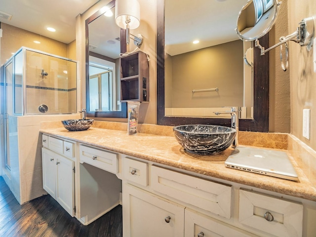 3419 Gillespie St, Houston, TX 77020 - full bath featuring wood finished floors, a shower stall, vanity, and recessed lighting