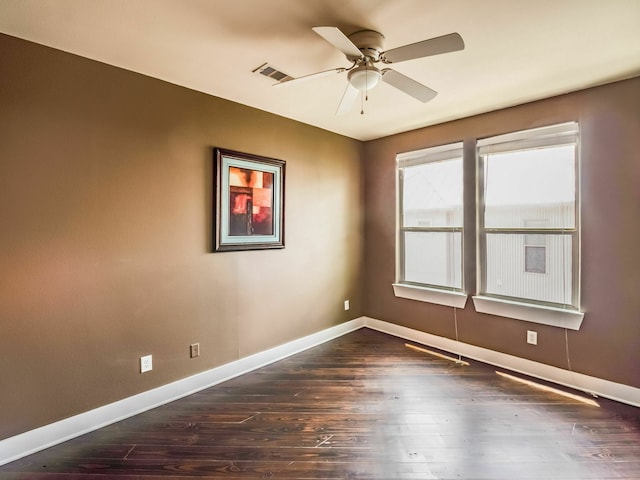 3419 Gillespie St, Houston, TX 77020 - spare room featuring ceiling fan and dark wood-style flooring