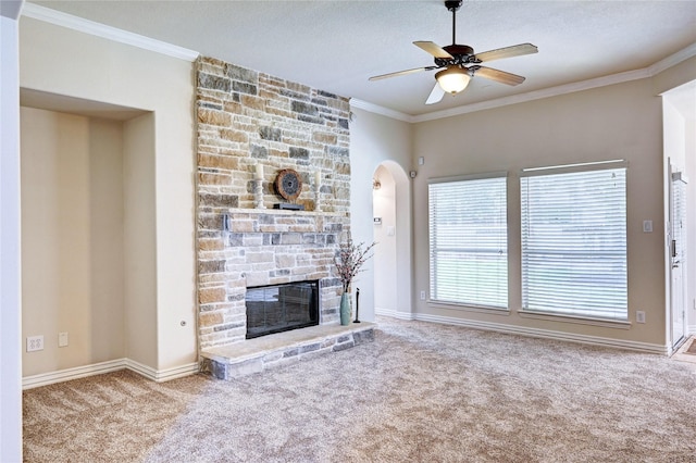 30 N Scribewood Cir, The Woodlands, TX 77382 - unfurnished living room with carpet floors, ceiling fan, ornamental molding, a fireplace, and a textured ceiling