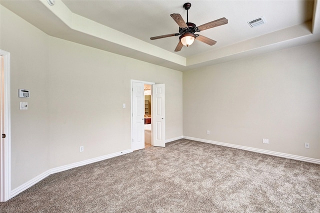 30 N Scribewood Cir, The Woodlands, TX 77382 - carpeted spare room featuring a tray ceiling and a ceiling fan